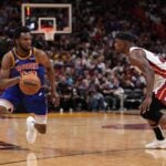 Miami Heat forward Jimmy Butler guards Golden State Warriors wing Andrew Wiggins (Wiggins is currently a Toronto Raptors trade candidate)