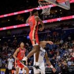 Jan 29, 2025; New Orleans, Louisiana, USA; Dallas Mavericks forward P.J. Washington (25) has his shot swatted away by New Orleans Pelicans center Yves Missi (21) during the first half at Smoothie King Center.